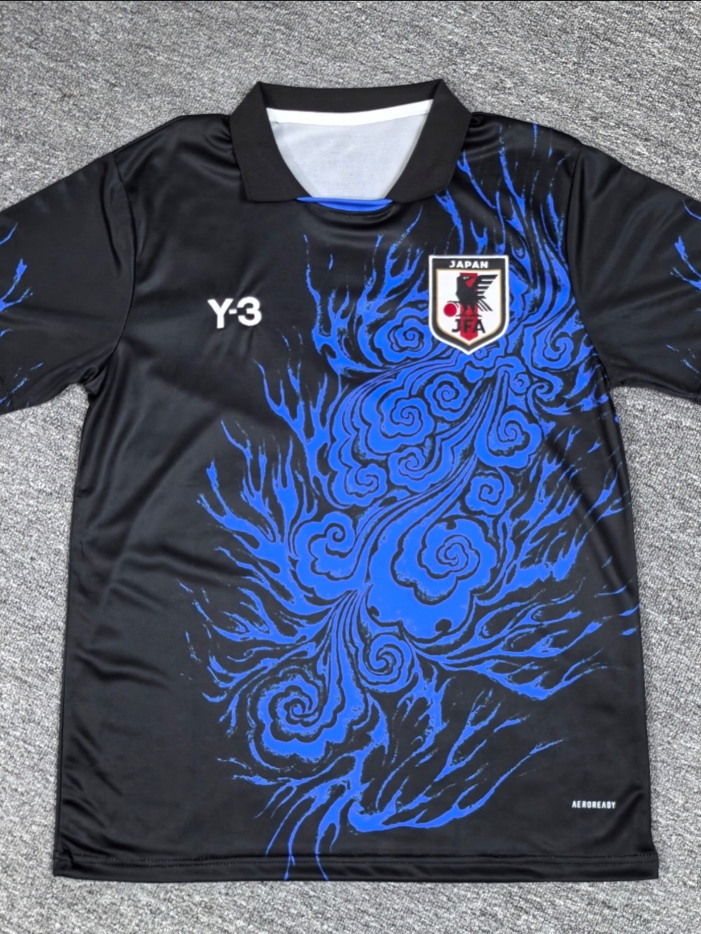 Y-3 Mens Black Japan Football International Jersey with Blue Crest Flame Graphic